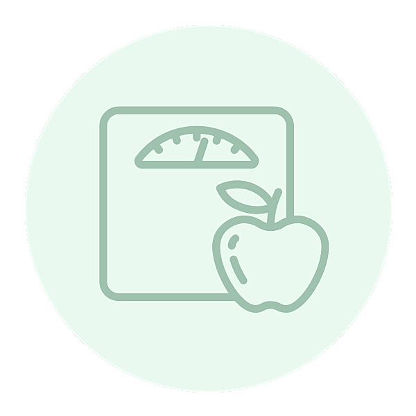 Scale and apple representing health and weight management
